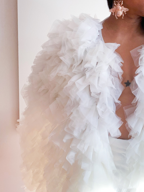Close-up of tulle ruffle cape by the lotus bloom co.