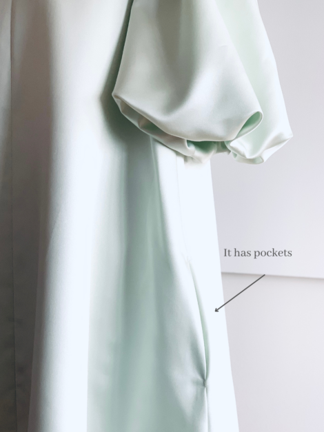 Hidden pocket close-up of cool mint green satin smock dress by the lotus bloom co.