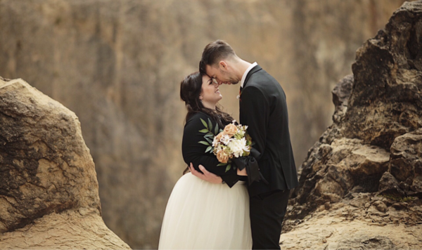 Beach engagement with groom and bride wearing ivory maxi tulle skirt.